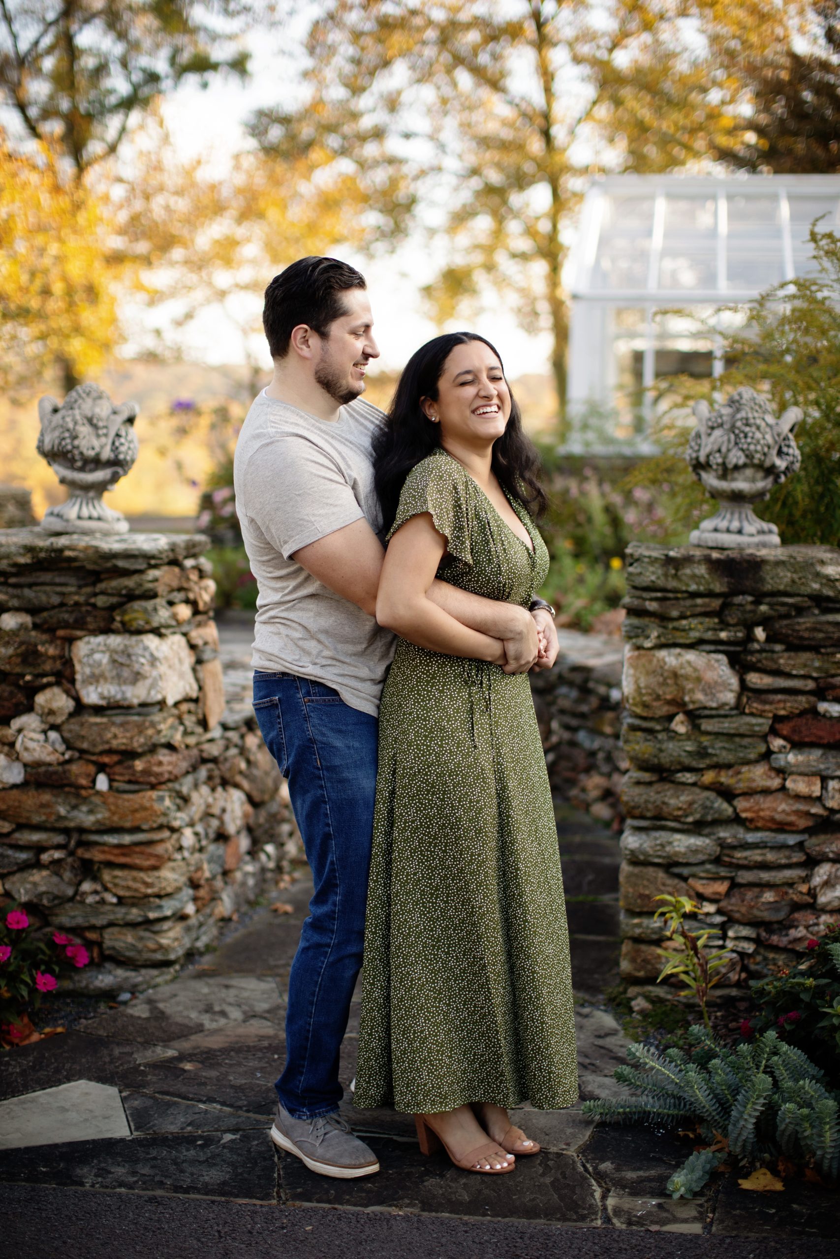 Engagement couple in the fall at Drumore Estate, Lancaster PA in a casual romantic green dress.
